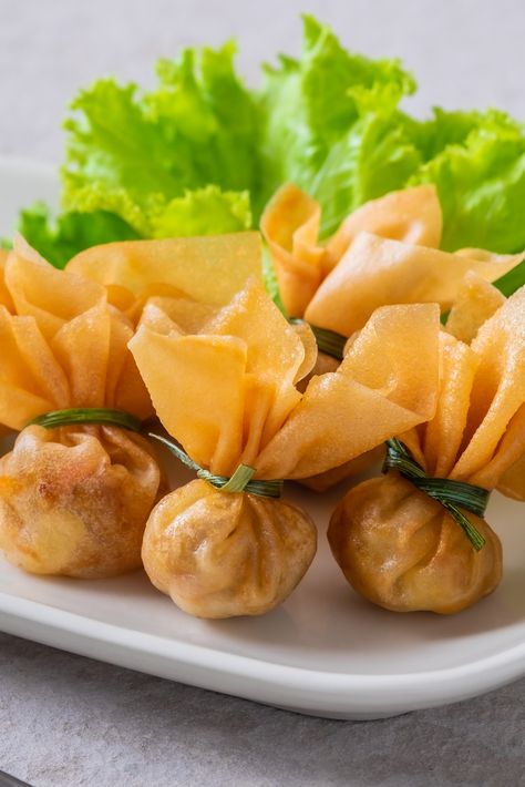 Thung Thong or Thai Money Bags are a delicious Thai snack or appetiser, part of the traditional Thai Royal Cuisine and often eaten at parties or served at special occasions such as Thai New year. This recipe is easy and perfect for prepping ahead of time, check out the new 1-click recipe! Thai Money, Thai Appetizer, Spring Roll Pastry, Thai Snacks, Thai Spices, Meals For Four, Money Bags, Thai Dessert, Sweet Chilli Sauce