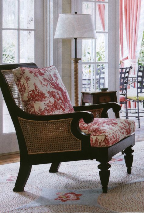 Red toile cushions on wood and cane chair. Classic combo, natural cane, black frame, toile fabric Cane Chairs Living Room, British Colonial Style Living Room, Black Wood Chairs, Colonial Living Room, Cane Chairs, Chair Classic, Trendy House, British Colonial Decor, Red Toile