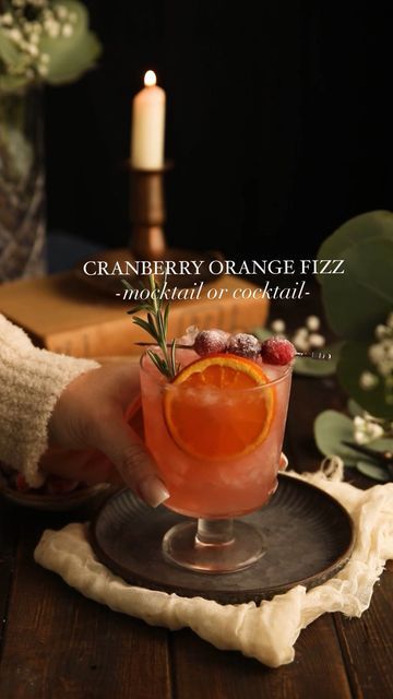 Ashley McCrary on Instagram: "✨CLICK HERE FOR RECIPE✨ 5-minute cranberry cocktail or mocktail perfect for the holidays. A combination of gin (or not), citrus juices, cranberry juice, bitters, and ginger beer. Garnished with dried orange, sugared cranberries, and a sprig of rosemary. The best! ✨MOCKTAIL✨ ▢2 oz cranberry juice ▢2 oz orange juice ▢0.5 oz lemon juice ▢2 oz ginger beer or ginger ale (ginger beer is non alcoholic) ▢2 tsp simple syrup or sugar-free simple syrup ✨COCKTAIL✨ ▢2 oz cranberry juice ▢1 oz orange juice ▢0.5 oz lemon juice ▢2 tsp simple syrup or sugar-free simple syrup ▢1 oz gin ▢2-3 dashes orange bitters ▢2 ounces of ginger beer #mocktails #mocktailsofinstagram #cocktails #holdiays #holidayrecipes #holidayseason #prettydrinks #cranberries #gin" Gin Ginger Ale Cocktails, Dried Orange Cocktail, Xmas Mocktails Non Alcoholic, Cranberry Orange Mocktail, Ginger Ale Mocktail Recipe, Mocktails Cranberry, Herbal Mocktails, Ginger Beer Mocktail Recipe, Christmas Mocktail