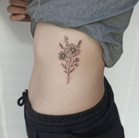 October And April Flower Tattoo, Birth Flower Tattoos On Ribs, Bouquet Tattoo With Words, Wildflower Bouquet Tattoo Simple, Daisy Tattoo Ribs, Bouquet Tattoo On Ribs, Three Flower Bouquet Tattoo, Daisy And Daffodil Tattoo, Barney Tattoo