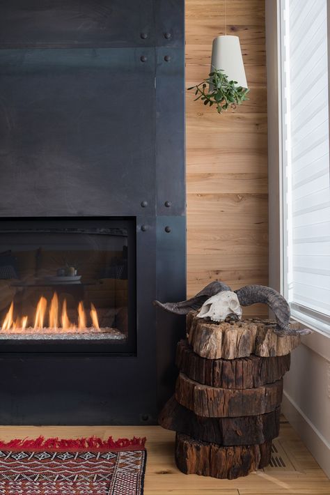 A black fireplace surround has been paired with a wood wall and wood floor in this home. Studio Mcgee Fireplace, Mantel Styling, Metal Fireplace, Black Fireplace, Concrete Fireplace, Faux Fireplace, Fireplace Remodel, Home Fireplace, Fireplace Makeover