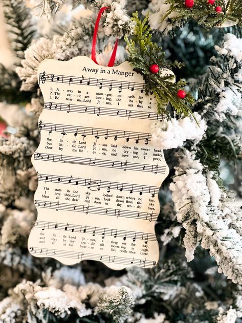 how to mod podge christmas hymns to create ornaments Hymn Ornaments Diy, Vintage Christmas Decorations Diy Sheet Music, Christmas Ornaments Made From Sheet Music, Hymnal Ornaments Diy, Diy Wooden Christmas Ornaments Ideas, Christmas Carol Ornament Diy, Modge Podge Wood Ornaments, Mod Podge Ornaments Diy, Modge Podge Christmas Ornaments