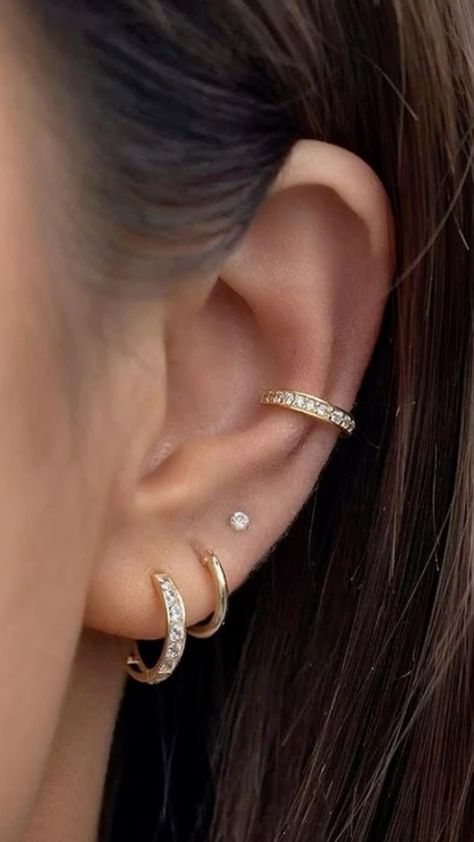 Discover trendy ear piercing ideas that range from classic lobes to edgy helix and daith piercings! Get inspired to mix and match styles for a personalized look. ✨ #EarPiercingIdeas #PiercingInspo #HelixPiercing #LobePiercing #DaithPiercing #PiercingStyle #Piercing #nosepiercing #bellybuttonpiercing #industrialpiercing #lippiercing #tonguepiercing #earpiercing #cartilagepiercing #spiderbitepiercing #multipleearpiercing #facialpiercing #hippiercing #earcuff #earjewelry #eargauge  #goldearrings #earplugs #diamondearrings #pearlearrings #earmuffs #silverearrings #hoopearrings #beadedearrings Dainty Piercings Ears Minimalist Jewelry, Ear Piercings Inspiration Simple, Pretty Ear Piercings Simple, Mismatched Ear Piercings, Ear Piercings For Women Over 50, Minimal Ear Piercing Ideas, Earing Piercing Idea, Triple Earlobe Piercing Ideas, How To Style Ear Piercings