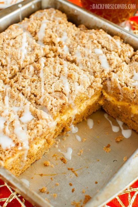 Pumpkin Cream Cheese Coffee Cake with Streusel is the ultimate fall recipe. This pumpkin spiced cake is great for holidays, breakfast, brunch, or dessert! Pumpkin Cheesecake Coffee Cake, Pumpkin Cream Cheese Coffee Cake Recipes, Pumpkin Coffee Cake With Cream Cheese, Pumpkin Cream Cheese Coffee Cake, Pumpkin Strudel Coffee Cake, Coffee Cake Cream Cheese, Coffee Cake With Cream Cheese, Pumpkin Streusel Coffee Cake, Cream Cheese Pumpkin