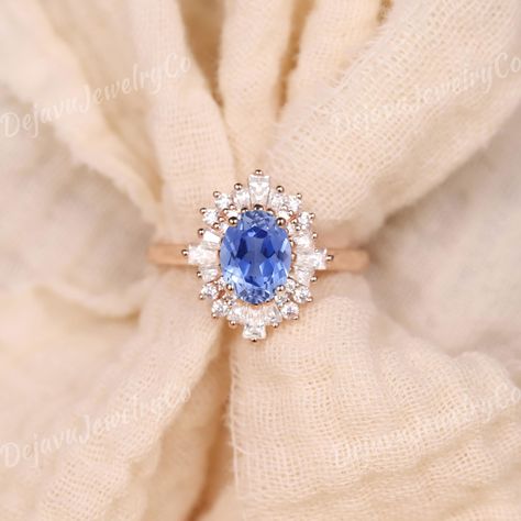 Exquisite Vintage Oval Cornflower Blue Sapphire Engagement Ring in Rose Gold, Accented with Alternating Baguette and Round Moissanite Stones in a Halo Design. This Art Deco-Inspired Bridal Ring is a One-of-a-Kind Sapphire Boho Ring, Perfect for Anniversaries or as a Baby Blue Accessory for a Touch of Vintage Elegance. ✦ Handmade, high-quality item ✦ Material: SOLID 10K/14K/18K GOLD ( can be made in yellow/white/rose gold ) ✦Engagement ring ✦ Center stone: Lab sapphire  ✦ Size/Weight: 5*7mm ✦ Col Vintage Sapphire Engagement Rings, Oval Sapphire Engagement Ring, Vintage Engagement Rings Sapphire, Rose Gold Engagement Ring Vintage, Sapphire Wedding Band, Vintage Sapphire, Blue Accessories, Sapphire Engagement Ring Blue, Round Moissanite