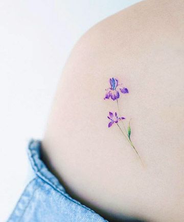 Dainty shoulder tattoos These dainty details are sure to wow. Dainty Iris Tattoo, Dainty Shoulder Tattoo, Iris Flower Tattoo, Violet Tattoo, Cool Shoulder Tattoos, Iris Tattoo, Small Shoulder Tattoos, Flower Tattoo Shoulder, Geniale Tattoos