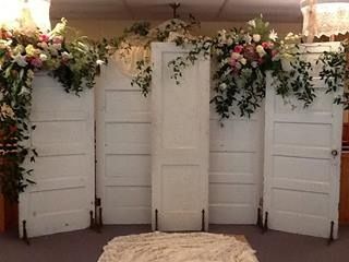 door supports, metal shelf brackets with holes(?) for stakes when used outside Door Backdrop, Barn Door Wedding Backdrop, Vintage Wedding Backdrop, Door Backdrops, Wedding Doors, Wedding Reception Backdrop, Vintage Doors, Rustic Doors, Shabby Chic Wedding