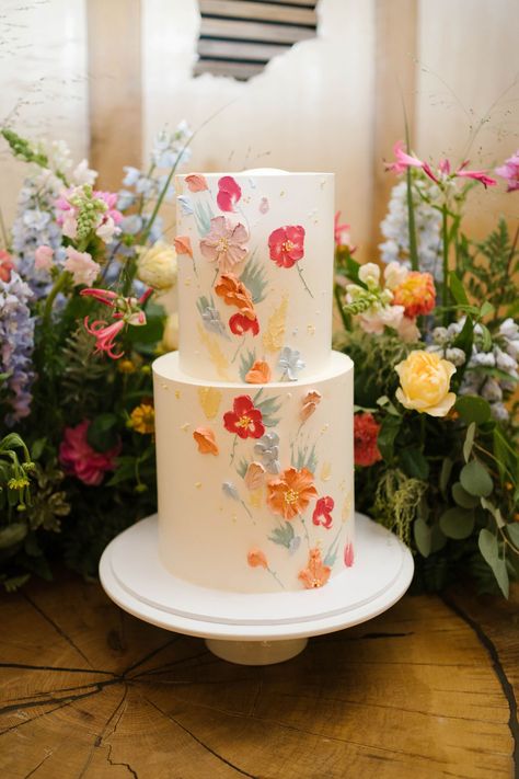 Wedding Cake With Painted Flowers, Spring Wedding Cake 2 Tier, Vibrant Color Wedding Cake, Simple Wedding Cake 2 Tier Flowers, Wedding Cakes With Icing Flowers, Wild Flower Cake Wedding, Bright Flower Wedding Cake, Wedding Cake With Tulips, Spring Garden Wedding Cake