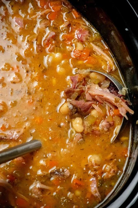 This easy Crock Pot Ham Bone and Bean Soup is a delicious and simple way to use up that leftover holiday ham bone, and comes together entirely in the crockpot! Ham And Bacon Soup, Chickpea And Ham Soup, Best Crock Pot Soup Recipes Ever, Ham And Bean Soup Recipes Using Ham Bone, Ham Bean Kale Soup Recipes, Crockpot Pea Soup With Ham Bone, Split Pea Soup With Hambone Crock Pot, Ham Bone Beans Crockpot, Ham Bone Soup Recipes Crock Pot Split Peas