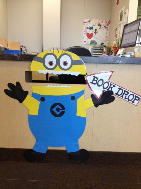 The students love to use the Book Drop now that they get to "feed" the Minion. Book Return Sign, Book Drop Decoration, Library Book Drop Decoration, Bookdrop Decor, Library Book Return Ideas, Book Return Ideas Library, Book Drop Ideas Library, Library Book Drop, Library Book Return