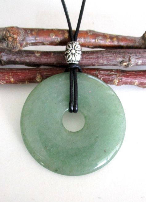 "Green Aventurine Natural Semi-Precious Gemstone Donut Shape Energy Pendant Necklace.  ED598 / ED598-A -50mm / ED637-40mm / ED302-30mm ED598 - Measures approx. 50 x 8mm = 2\" x ¼\".    ED598-A - Measures approx. 50 x 8mm = 2\" x ¼\".  Has small natural markings. ED637 - Measures approx. 40 x 7mm = 1 ½\" x ¼\".  Suspended on a continuous 31\" black leather cord strand without a clasp closure and accented with a silver tone Tibetan style bead. ED302 - Pendant measures approx. 30 x 7mm = 1 ¼\" x ¼\ Donut Pendant Necklace, Donut Necklace, Music Academy, Random Clothes, Donut Pendant, Green Aventurine Crystal, Aventurine Crystal, Donut Shape, Cord Jewelry