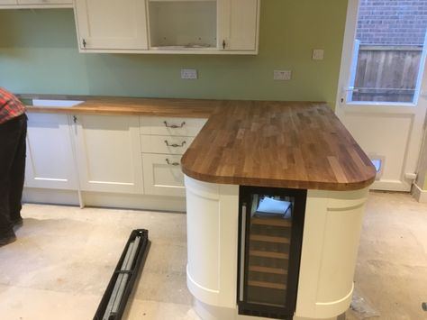 Oak breakfast bar with wine cooler Breakfast Bar With Wine Fridge, White Kitchen Oak Worktop, Bar With Wine Cooler, Bar With Wine Fridge, Kitchen Oak, Oak Worktop, Drinks Fridge, Cottage Kitchens, Kitchen Extension