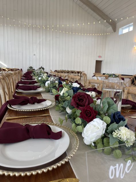 Eucalyptus Garland with Burgundy and Navy rose. Available for rental. Book your florals with us and save 70% of your decor cost. Link Below. Navy Wedding Centerpieces, Navy Centerpieces, Vintage Theme Wedding, Burgundy And Navy Wedding, Navy And Burgundy Wedding, Wedding Decor Table, Navy Wedding Flowers, Tiffany Wedding, Fall Vintage