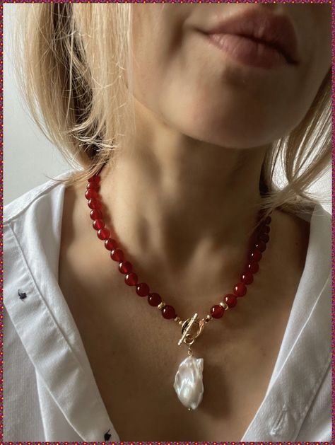 [SponsoredPost] Baroque Pearl And Red Agate Necklace This Statement Necklace Feature Real Fresh Water Baroque Pearl And Natural Stones - Red Agate. Beautiful Rich Red Color Makes This Necklace Very Eye-Catching. Elegant Gold Filled Toggle Clasp. Beads Measure 8Mm. Necklace Length Is 77 Cm (18,5 Inches). Please Note That Baroque Pearl May Slightly Vary In Shape As Effect Of Its Natural Origin. Handmade In Spain, Free Shipment With Registered Trackable Post. #pearlstatementnecklace Red Pearls Necklace, Pearl Handmade Necklace, Statement Beaded Necklace, Big Beaded Necklace, Red Bead Necklace, Red Jewerly, Red Beads Necklace, Statement Necklace Outfit, Red Pearl Necklace