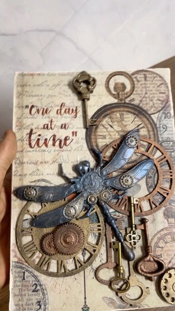 Robertson Artistry by Vishal | Mixed Media & Jewellery on Instagram: "One day at a time... This inspirational diary is just the motivation you need for those rough days.⠀ ⠀ I created this steampunk themed journal after find in a a matching decoupage paper from @itsybitsycraftstore to the resin dragonfly mould from @craftadda. This journal that can be used as a notebook, diary, for scrapbooking and sketching. It is an A5 journal with 64 blank pages.⠀ ⠀ DM me for more details. ⠀ #mixedmediajourn Steampunk Journal Cover, Steampunk Journal Pages, Steampunk Junk Journal Ideas, Punk Journal, Resin Dragonfly, Steampunk Scrapbooking, Recycled Fabric Art, Steampunk Junk Journal, Steampunk Journal