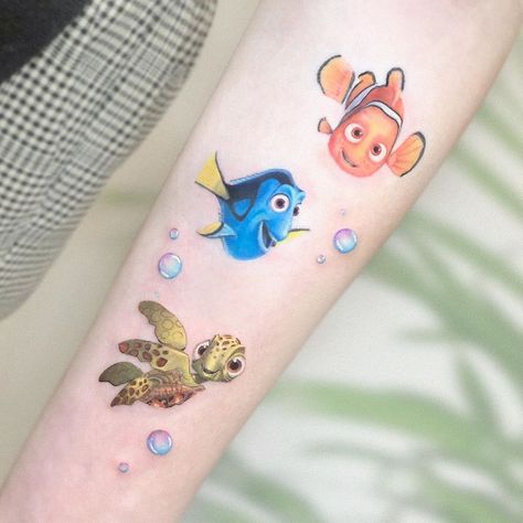 Finding Nemo tattoo inspo from Israel-based artist @kozo_tattoo. Click the link for more tattoos inspired by the wonderful world of Disney 🏰 #disneytattoo #tattooinspiration #tattoos #FindingNemo #animationtattoo Finding Nemo Tattoo, Dory Tattoo, Nemo Tattoo, Disney Inspired Tattoos, Disney Sleeve Tattoos, Trust Design, Culture Tattoos, Disney Sleeve, Literary Tattoos