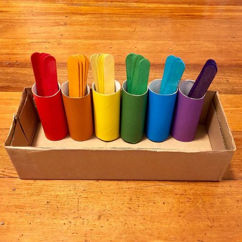 Bea ❤️ on Instagram: “🌈Here’s a simple colour sorting activity using tp rolls, cardboard box, coloured paper and large coloured popsicle sticks.🌈 . To make this,…” R Activity, Color Sorting Activities, Montessori Toddler Activities, Coloured Paper, Baby Learning Activities, Daycare Activities, Sorting Activities, Color Sorting, Kids Learning Activities