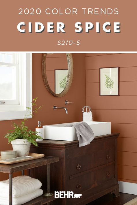 Snuggle up to the warm and cozy hue of BEHR® Paint in Cider Spice from the 2020 Color Trends Palette. A soft shade of red with brown undertones, this paint color is the perfect complement to the rich wood tones in this rustic bathroom. Click below for full color details to learn more. Brown Paint Colors, Bathroom Niche, Behr Paint Colors, Primitive Homes, Behr Paint, Bathroom Paint Colors, Shade Of Red, Bathroom Color, Room Paint Colors