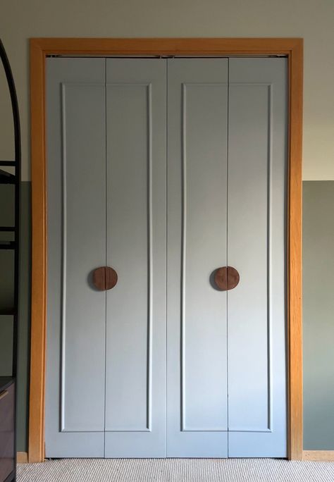 Learn how to give an old folding door a new completely new modern look with this DIY Closet Doors under $50 post!  A fresh coat of paint, adding some decorative trim molding and modern circular doorknob hardware gives your closet a fresh budget friendly feel.  Delineate Your Dwelling Diy Closet Door Upgrade, Refinish Bifold Closet Doors, Tri Fold Closet Door Makeover, Trim On Closet Doors, Bedroom Door Upgrade, Cane Bifold Closet Doors, Replacing Folding Closet Doors, Remodel Closet Doors, Bifold Door Makeover To French Doors