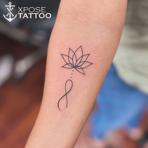 🌸 A small lotus with an infinity tattoo symbolizes everlasting growth and beauty. The delicate petals of the lotus represent resilience and the infinity symbol represents endless possibilities. This combination is a powerful reminder to never stop growing and to embrace the journey of life. Let this beautiful tattoo be a constant source of inspiration and motivation. #lotustattoo #infinitytattoo #endlesspossibilities #neverstopgrowing #tattooinspiration #professionalink #tattooink #tattooart ... Dehli India, Infinity Symbol Tattoo, Never Stop Growing, Tattoo Maker, Journey Of Life, Beautiful Tattoo, Embrace The Journey, Lotus Tattoo, Tattoo Parlors