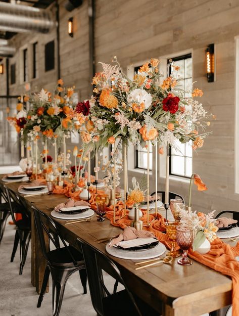 Fall Boho Vibes at Rivers Lodge - Wed KC Kansas City Wedding Experts August Wedding Decor, Elegant Fall Wedding Centerpieces, Burnt Orange Wedding Colors, Autumn Wedding Centerpieces, Burnt Orange Boutonniere, Bridesmaid Dresses Burnt Orange, Tan Groom Suit, Wedding Colors 2025, Orange Wedding Centerpieces