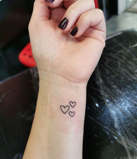 Simple Tattoo For Mom Of 3, Tiny Tatts Small Tats, Small Heart Tattoo On Wrist Mother Daughters, Three Hearts Tattoo Wrist, 3 Hearts Tattoo Ideas On Wrist, Small Heart Wrist Tattoos For Women, 3 Hearts Tattoo Ideas Family, Mom Heart Tattoo Simple, Wrist Tattoos Heart