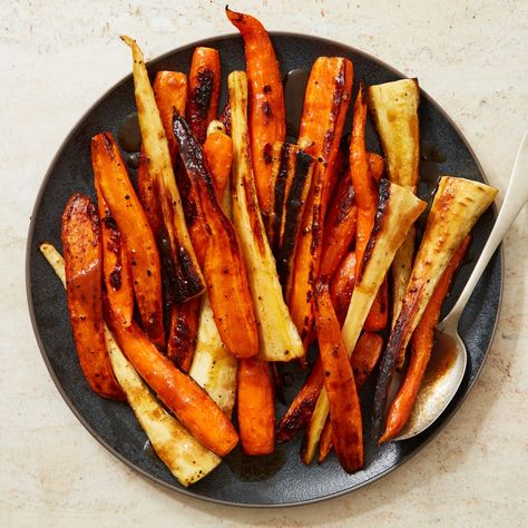 Roasted Carrots and Parsnips With Honey Recipe | Epicurious Garlic Sweet Potato Fries, Carrot And Parsnip Recipe, Honey Glazed Roasted Carrots, Carrots And Parsnips, Roasted Carrots And Parsnips, Parsnip Recipes, Rosh Hashanah Recipes, Crispy Sweet Potato Fries, Honey Glazed Carrots