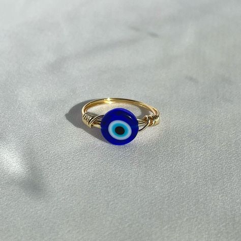 Wire Wrapped Evil Eye Ring 🧿 • • • #wirewrappedjewelry #wirewrappedring #wirewrapping #wirewrappedcrystals #etsyseller #etsysellersofinstagram #etsyhandmade #etsyhandmadejewelry #shopsmall #etsyjewelry #evileye #evileyejewelry #evileyering Eye Wire Wrap, Diy Resin Gifts, Resin Gifts, Wire Wrap Ring, Etsy Jewelry Handmade, Evil Eye Ring, Wrap Ring, Wire Wrapped Rings, Eye Ring