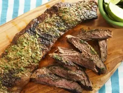 Sunny’s Skirt Steak with Cowgirl Butter Recipe | Sunny Anderson | Food Network Skirt Steak Recipes, Sunny Anderson, Flat Iron Steak, Pepper Steak, Skirt Steak, Whole Foods Market, Butter Recipe, Grilled Vegetables, Beef Dishes