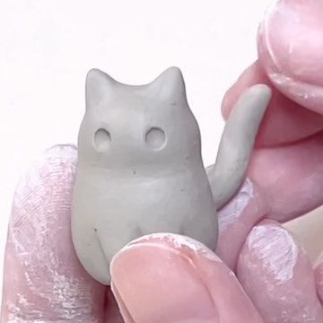 Tham Nguyen on Instagram: "My behind the scene sculpting black cat with ghost mask 🐈‍⬛👻. I love making my cats extra round. It was very time consuming to set up a good angle for my tiny cats but I’m happy with the result 😸💕 #blackcatart #catartwork" Clay Cat Step By Step, Cat Made Out Of Clay, Mini Clay Cat, Air Dry Clay Cats, Cat Air Dry Clay, Cat Clay Ideas, Cat Ceramic Ideas, Cat Clay Sculpture, Cat Clay Art