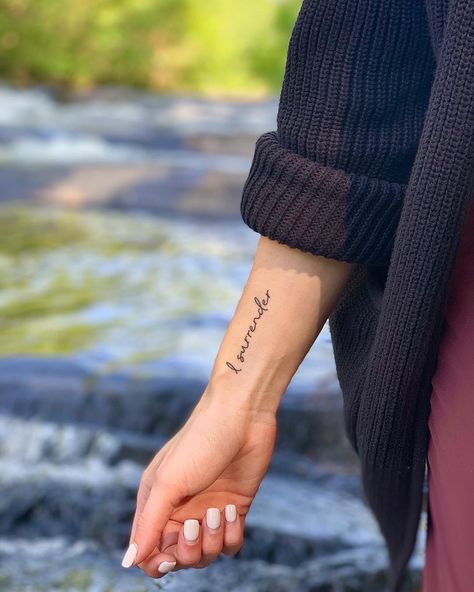 Wrist tattoo dainty tattoo surrender hill song Writing Wrist Tattoos For Women, Word On Wrist Tattoo, Wrist Tattoo Script, I Surrender All Tattoo, Small Outer Wrist Tattoo, Wrist Script Tattoos For Women, I Surrender Tattoo, Enough Wrist Tattoo, Script Wrist Tattoo