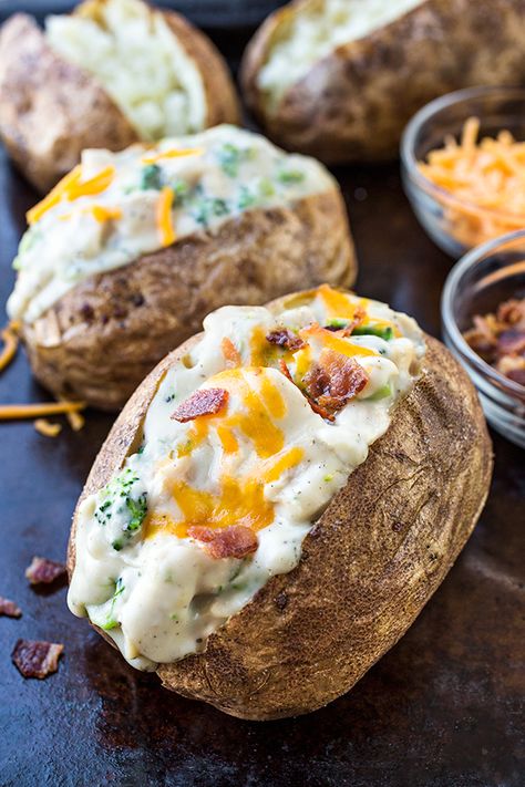 These stuffed potatoes with chicken and broccoli sauce are a creamy and decadently savory meal prepared with just a few simple ingredients! | thecozyapron.com #stuffedpotatoes #stuffedbakedpotatoes #stuffedpotatoesrecipe #stuffedbakedpotatoesrecipe #stuffedpotatoeshealthy #stuffedbakedpotatoeshealthy #stuffedpotatoeseasy Creamy Chicken Broccoli, Creamy Chicken And Broccoli, Stuffed Baked Potato, Chicken Broccoli Bake, Stomach Rumbling, Potatoes Baked, Stuffed Potatoes, Stuffed Baked Potatoes, Broccoli Bake