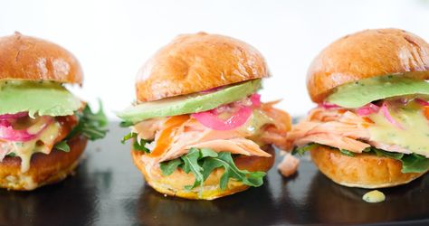 Ingredients ½ lb Alderwood Smoked Salmon Pickled Red Onions Slider buns--toasted Avocado Argula Garlic-Dill Aioli Ingredients 1 clove garlic 1 egg yolk 1 tsp lemon juice 1 tsp mustard 3 T olive oil 2 T vegetable oil salt and pepper 1 tsp dill - minced Garlic-Dill Aioli Directions Mash garlic into a paste with a mortar and pestal. Whisk in egg yolk, mustard, and lemon juice until it's smooth. Slowly drizzle in the oil while whisking to emulsify. Season with salt, pepper, and add dill. Pic Smoked Salmon Sliders, Salmon Sliders, Easter Sunday Brunch, Winter Whimsy, Slider Sandwiches, Slider Buns, Famous Recipe, Pickled Red Onions, Red Onions