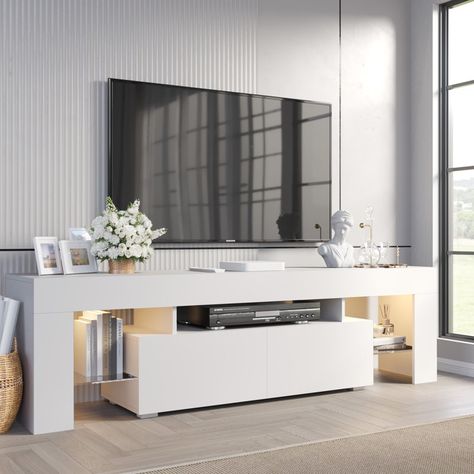 Orren Ellis Manjesh TV Stand for TVs up to 70" & Reviews | Wayfair https://www.wayfair.com/furniture/pdp/orren-ellis-manjesh-tv-stand-for-tvs-up-to-70-w011406592.html?piid=633386164 Stand For Tv, Tv Stand With Led Lights, White Tv Stands, Led Tv Stand, Drawers And Shelves, Modern Entertainment Center, Tv Console Table, Tempered Glass Shelves, Console Storage