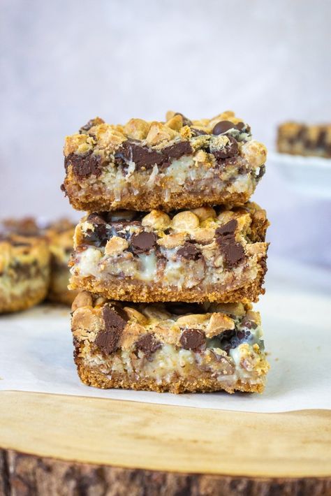 Texas Gold Bars, Healthy Magic Bars, Big Group Desserts, Magic Bars 7 Layer, Millionaire Magic Bars, Magic Layer Bars, 7 Layer Bars Eagle Brand, O'henry Bars Recipe, 7 Layer Cookies Recipe