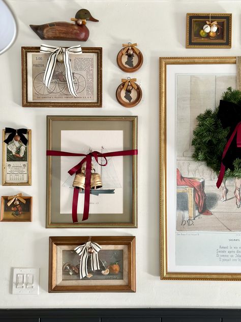 easy and budget friendly ways to decorate for christmas, decorating with bows, decorating art for christmas, christmas decor ideas, bows on frames, decorating art for christmas, christmas diy, framing wrapping paper, decorating gallery wall for christmas, bows on art, wreath on art Wreaths On Built Ins, Christmas Entryway Wall Decor, Accordion Rack Christmas Decor, Blank Wall Christmas Ideas, Wreath Gallery Wall, Wrapped Frames On Wall Christmas, Bows On Picture Frames Christmas, Bows On Frames Christmas, Wrapped Wall Art For Christmas