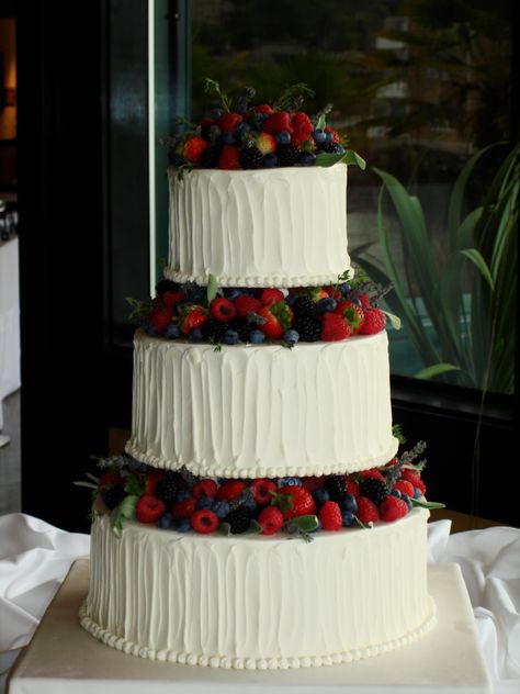 Buttercream and fresh fruit wedding cake Fruit Cake For Wedding, Wedding Cake Tres Leches, Fruit On Wedding Cake, Wedding Cake With Fresh Fruit, Huckleberry Wedding Cake, Wedding Cake Fresh Fruit, Wedding Cakes Strawberries, German Wedding Cake, Wedding Cake Fruit Decorations