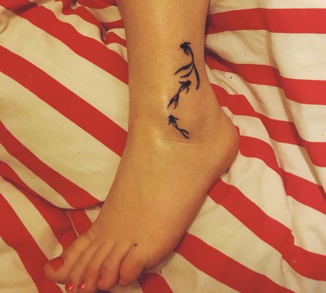 Three little fish, small and pretty tattoos. Done by The Ink Factory, Dublin Three Fishes Tattoo, Three Fish Tattoo, Tattoo Ankle, Twin Tattoos, Self Love Tattoo, Fish Tattoo, Fun Clothes, Small Tattoo Designs, Ankle Bones