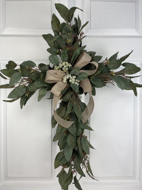 Lovely Eucalyptus Cross Wreath for Easter Moss Cross Wreath, Cross Shape Wreath Frame, Seasonal Door Wreaths, Christian Wreaths For Front Door, Easter Cross Door Hanger, Graveside Decorations Diy, Cross Wreaths For Front Door, Dollar Tree Cross Wreath Ideas, Church Sanctuary Decor Interiors