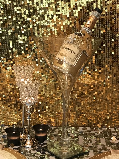 Hennessy bottle centerpiece Hennessy Party Ideas Decor, Hennessy Party, Hennessy Bottle, Bedazzled Liquor Bottles, 50th Birthday Party Ideas For Men, Decorated Liquor Bottles, Diy Water Fountain, Bottle Centerpieces, Diy Wine Glasses