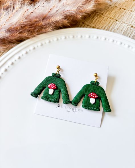 We are live! Check out our newest launch! #spookyseason #spookyszn #halloweenvibes #halloweenearrings #fallvibes #cuteearrings #polymerclay #polymerclayartist #clayartist #earringsforsale #witchyvibes #witchyearrings #handmadewithlove #smallbusiness #autumnvibes Textured Sweatshirt, Sweater Earrings, Mushroom Sweater, Clay Christmas, Polymer Clay Christmas, Textured Sweater, Long Periods, Halloween Earrings, Trinket Dishes