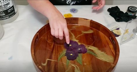 Learn how to pour resin like a pro with this tutorial. You’ll learn how to incorporate color, glitter, and pressed flowers into resin to create the perfect accent tray. Resin Lazy Susan, Coloring Resin, Peg Board Shelves, Diy Lazy Susan, Diy Resin Tray, Press Flowers, Dried Flowers Diy, Flower Tray, Accent Tray