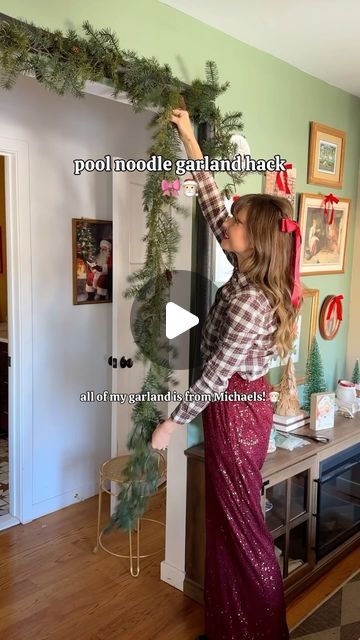 Steffy 🧡 on Instagram: "DIY Pool Noodle Garland 🎅🏻❤️🎁 Using 3 pool noodles and 6 layered pieces of garland from @michaelsstores I created this beautiful archway in my bedroom! With some twinkle lights and bows, it feels like pure magic! ✨I was debating between the big red bow on top, or adding more red ornaments - which do you like more?#everythingtocreateanything #michaels #christmastree #christmasornaments #ornaments" Garland Over The Door, Pool Noodle Christmas Garland Diy Ideas, Pool Noodle Archway, Pool Noodle Christmas Archway, Christmas Decor Ideas For Archways, Diy Door Garland Christmas, Pool Noodle Mantle Garland, Archway Garland Christmas, Pool Noodle Mantel Garland