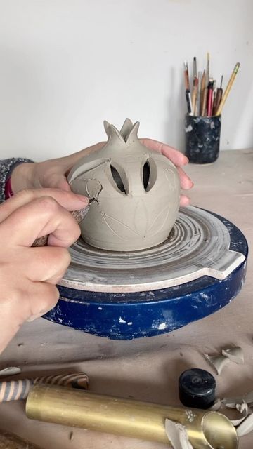 Penina Shoshan on Instagram: "I cut 43 minutes of process out of this video, but left in my clementine snack break. You’re welcome. This pomegranate luminary was inspired by pots I saw on the island of Sifnos, Greece. #pomegranate #luminary #light #clayprocess #playwithclay #handmadegift" Pomegranate Clay Art, Clay Pomegranate, Pomegranate Vase, Pomegranate Bowl Ceramic, Pomegranate Ceramic, Pomegranate Ceramic Handmade, Sifnos Greece, Ceramic Pomegranate, Pottery Inspo