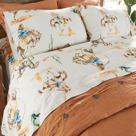 PRICES MAY VARY. BRONCO WESTERN VINTAGE COWBOY SHEET SET: features western icons of bronco-riding cowboys in the desert in warm tones of rust, gold, with pops of blue and green on a warm cream background. The timeless cowboy and bronco design makes this sheet set the perfect way to finish your bedset. SOFT AND COMFORTABLE LUXURY: Made from the softest cotton, this sheet will never feel heavy, stiff or uncomfortable. Our Bronco Vintage Western Cowboy sheets have an ultra soft feel that you will s Western Bunk Beds, Modern Western Room Decor, Bright Western Decor, Ranch House Bedroom Decor, Little Boy Cowboy Room, Western Bed Sheets, Retro Western Bedroom, Brother And Sister Shared Room, Western Pop Up Shop