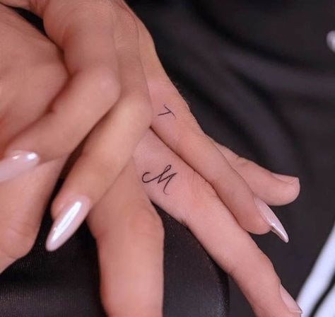 Couples Tattoos Ring Finger, Initial Tattoo Ideas Couple Ring Finger, Finger Marriage Tattoos, M Finger Tattoo, Husband Tattoo Ideas, Tattoo Ring Finger Initials, Initial On Ring Finger Tattoo, Initial Finger Tattoo Wedding Bands, Initial Finger Tattoo