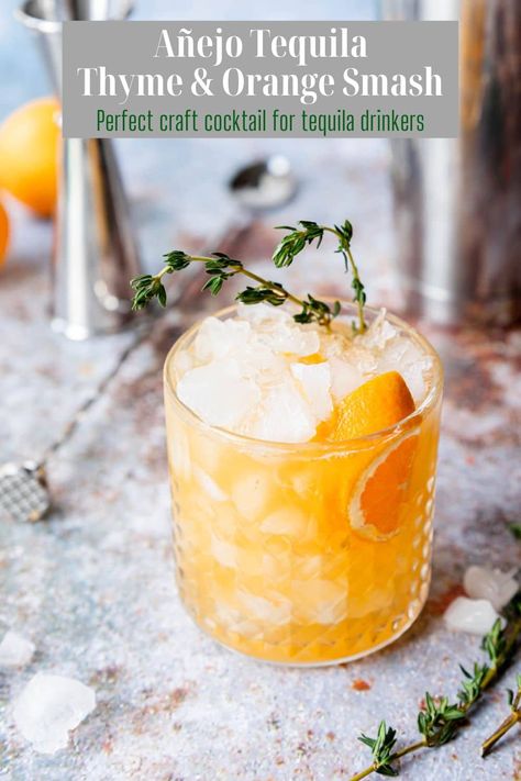 A really beautiful and delicious tequila smash cocktail with flavors of Añejo tequila, orange and thyme. This is an at-home craft cocktail! Ginger Tequila Cocktail, Fall Cocktails With Tequila, Tequila Smash, Orange Simple Syrup, Spicy Cocktail, Tequila Cocktail, Orange Drinks, Cocktail And Mocktail, Craft Cocktail