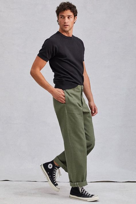 Men's olive green workwear pants with black t-shirt and high tops outfit. This outfit first appeared in the article: Men’s Green Pants Outfit Inspiration: 14 Modern Looks For 2022, on MensFlair.com Olive Green Pants Men, Mabel Outfits, Green Pants Outfit Men, Olive Pants Men, Green Trousers Outfit, Olive Pants Outfit, Olive Green Pants Outfit, Chinos Men Outfit, Trousers Outfit Men