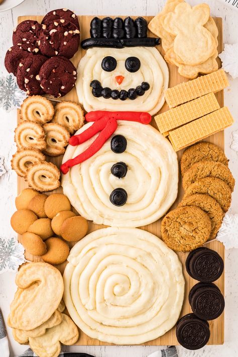 A sweet spin on the viral butter board trend, this Snowman Buttercream Board is as yummy as it is festive! Fun frosting and cookies! Buttercream Board Snowman, Snowman Buttercream Board, Cookie Boards For Parties, Christmas Themed Boards Food, Dessert Board Christmas, Cookie Board Platter, Christmas Butter Board, Buttercream Boards, Christmas Dessert Board