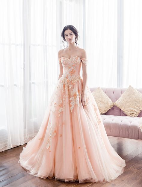 Sweet, feminine, romantic, and refreshing, peach has become one of the hottest trends in recent weddings! The color is a sophisticated blend of both contemporary and classic elegance, making peach dresses a great alternative for traditional gowns. Its soft touch and dreamy tone are perfect for graceful brides. Here are some of our favorite gowns in peach, let’s dive in! Peach Gowns, Peach Wedding Dress, Peach Dresses, Debut Gowns, Peach Gown, Traditional Gowns, Peach Colour, Feminine Romantic, Peach Dress